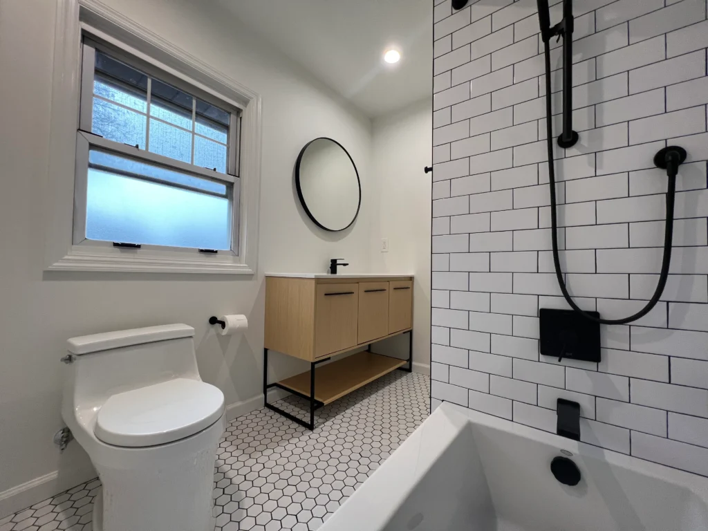 Full Bathroom Renovation with White Subway Tile Tub Surround, Matte-Black Fixtures, and Hexagon Mosaic Flooring in Bloomfield, Essex County, NJ
